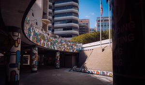 Preview wallpaper buildings, bridge, pilings, graffiti