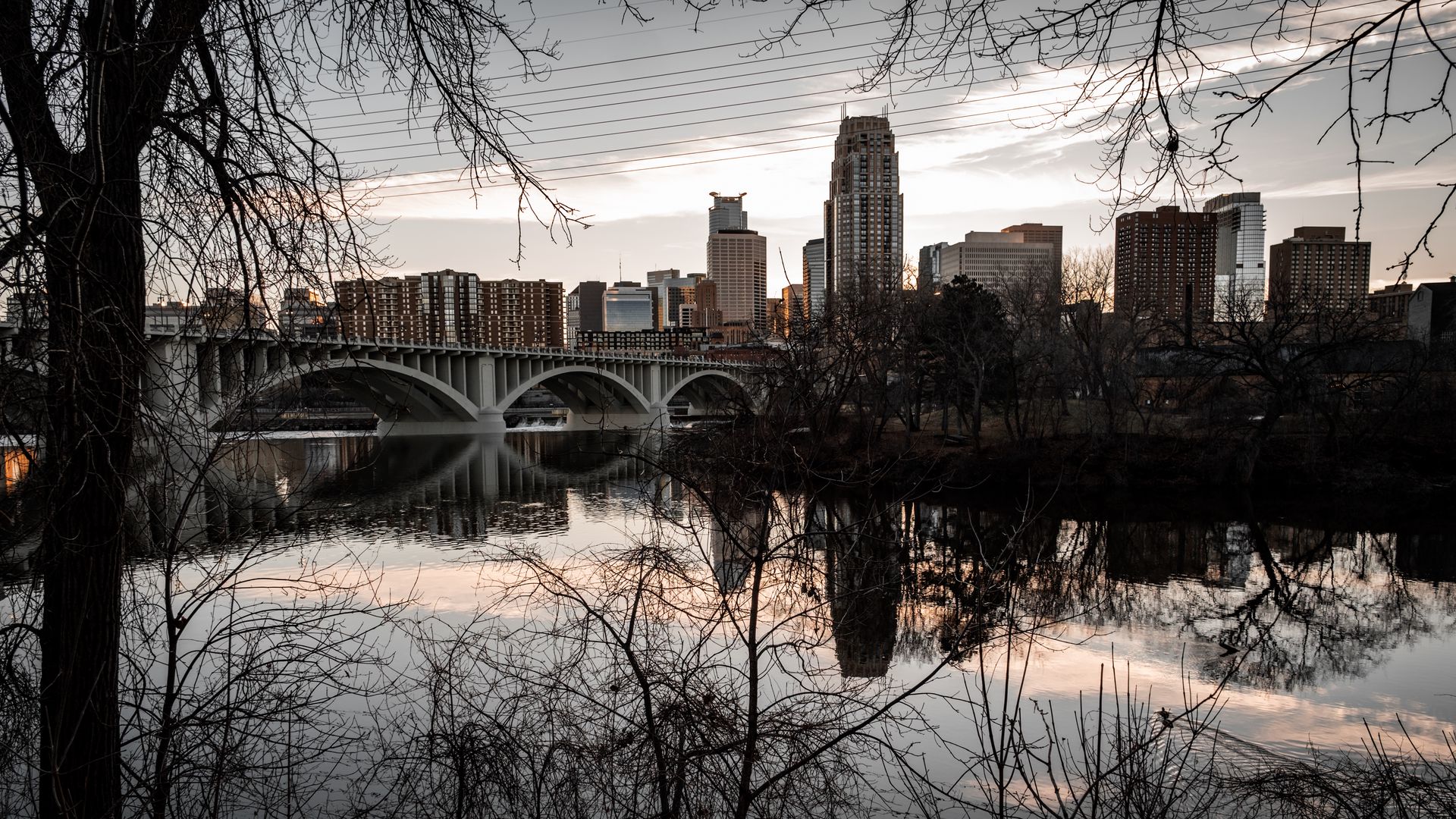 1920x1080 Wallpaper buildings, bridge, reflection, river, city, trees