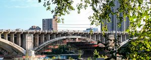 Preview wallpaper buildings, bridge, river, trees, leaves