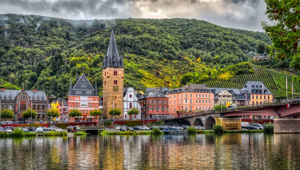 960x544 Wallpaper buildings, bridge, river, mountains, clouds, city