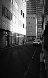 Preview wallpaper buildings, bw, street, man, city