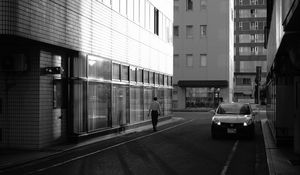 Preview wallpaper buildings, bw, street, man, city