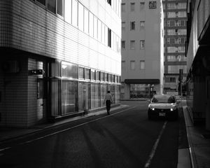 Preview wallpaper buildings, bw, street, man, city