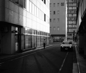 Preview wallpaper buildings, bw, street, man, city