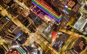 Preview wallpaper buildings, city, aerial view, colorful, backlight