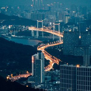 Preview wallpaper buildings, city, aerial view, road, bridge, night, fog