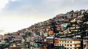 Preview wallpaper buildings, city, architecture, slope, sky
