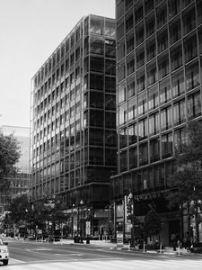 Preview wallpaper buildings, city, car, trees, street, bw
