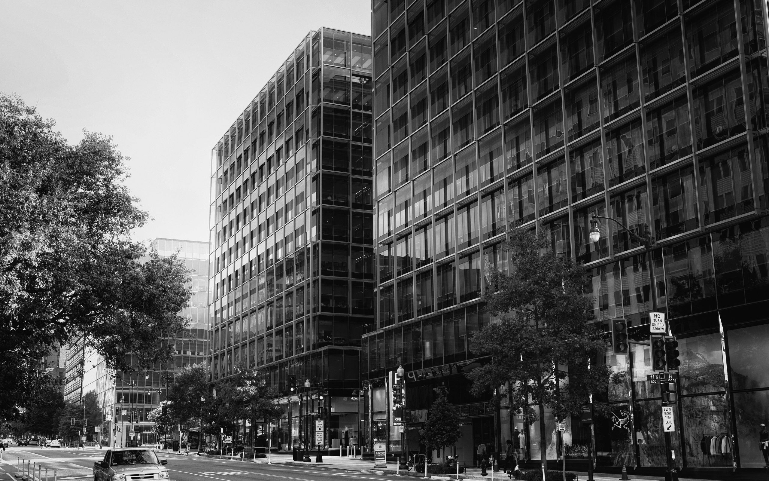 2560x1600 Wallpaper buildings, city, car, trees, street, bw
