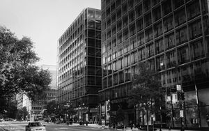 Preview wallpaper buildings, city, car, trees, street, bw