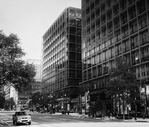 Preview wallpaper buildings, city, car, trees, street, bw