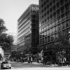 Preview wallpaper buildings, city, car, trees, street, bw