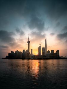 Preview wallpaper buildings, city, coast, sunset, water, architecture