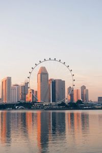 Preview wallpaper buildings, city, ferris wheel, water