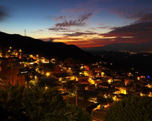 Preview wallpaper buildings, city, lights, hills, silhouettes, evening