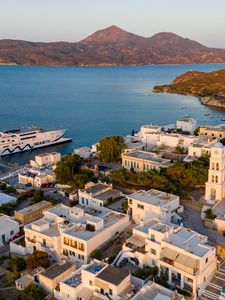 Preview wallpaper buildings, city, mountains, sea, boat
