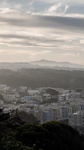 Preview wallpaper buildings, city, mountains, clouds
