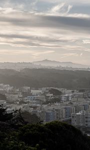 Preview wallpaper buildings, city, mountains, clouds