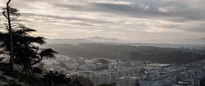 Preview wallpaper buildings, city, mountains, clouds