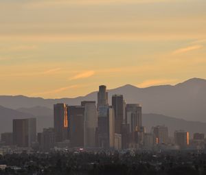 Preview wallpaper buildings, city, mountains, sunrise