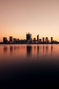 Preview wallpaper buildings, city, reflection, water, sky, twilight