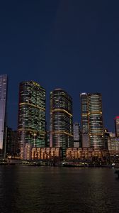 Preview wallpaper buildings, city, river, bridge, evening, night, dark
