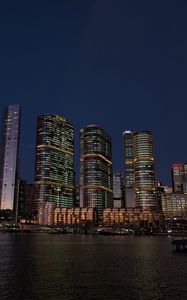 Preview wallpaper buildings, city, river, bridge, evening, night, dark