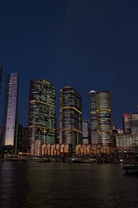 Preview wallpaper buildings, city, river, bridge, evening, night, dark