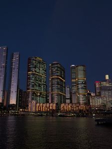 Preview wallpaper buildings, city, river, bridge, evening, night, dark