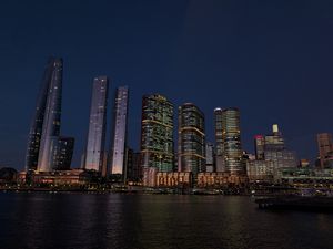 Preview wallpaper buildings, city, river, bridge, evening, night, dark