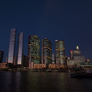 Preview wallpaper buildings, city, river, bridge, evening, night, dark