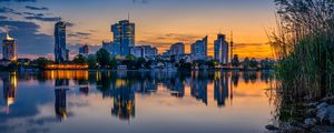 Preview wallpaper buildings, city, river, reflection, evening