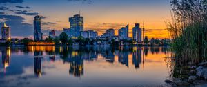 Preview wallpaper buildings, city, river, reflection, evening