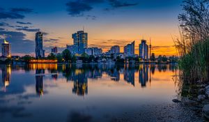 Preview wallpaper buildings, city, river, reflection, evening