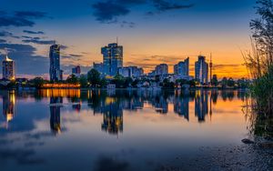Preview wallpaper buildings, city, river, reflection, evening