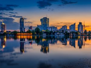 Preview wallpaper buildings, city, river, reflection, evening