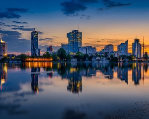 Preview wallpaper buildings, city, river, reflection, evening
