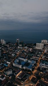 Preview wallpaper buildings, city, road, architecture, evening