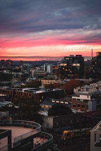 Preview wallpaper buildings, city, roofs, sunset