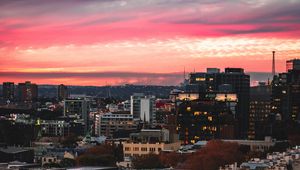 Preview wallpaper buildings, city, roofs, sunset