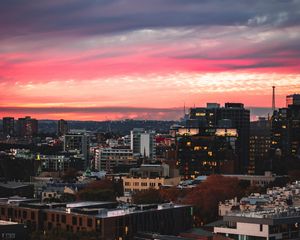 Preview wallpaper buildings, city, roofs, sunset