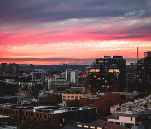 Preview wallpaper buildings, city, roofs, sunset