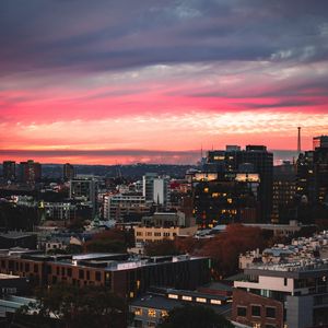 Preview wallpaper buildings, city, roofs, sunset