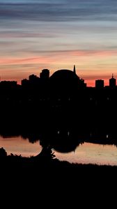 Preview wallpaper buildings, city, silhouettes, river, evening