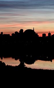 Preview wallpaper buildings, city, silhouettes, river, evening
