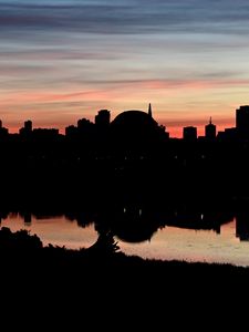 Preview wallpaper buildings, city, silhouettes, river, evening