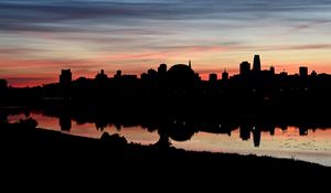 Preview wallpaper buildings, city, silhouettes, river, evening