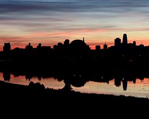 Preview wallpaper buildings, city, silhouettes, river, evening