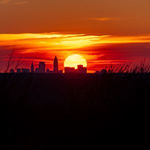 Preview wallpaper buildings, city, silhouettes, sun, sunset, dark