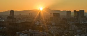 Preview wallpaper buildings, city, sunrise, mountains